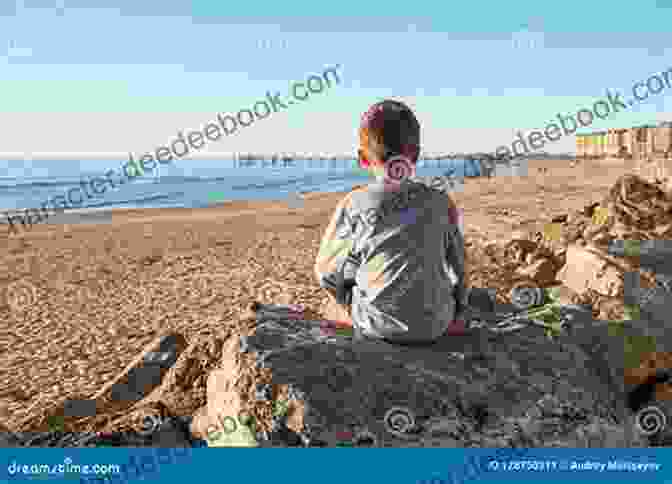 A Boy Sitting On A Rock, Looking Out At The Horizon. The Boy Who Said Nothing A Child S Story Of Fleeing Conflict