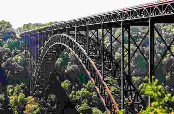 A Train Crossing A Bridge Over A River In The Appalachian Mountains From Trail To Railway Through The Appalachians
