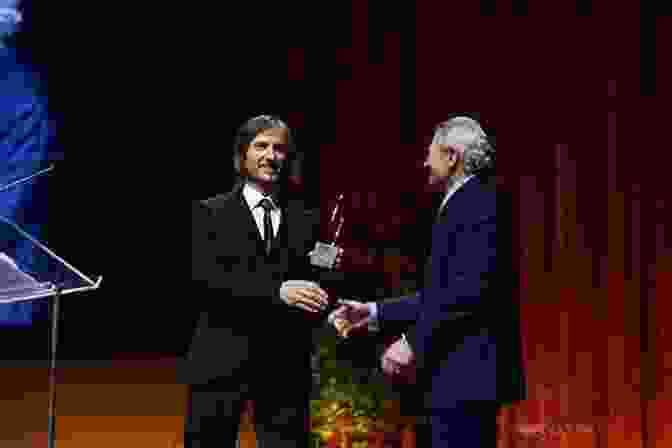 Carl Weber Receiving An Award On Stage The Choir Director Carl Weber